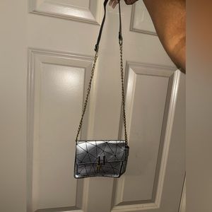 Silver and Black cross body bag with Gold and black strap